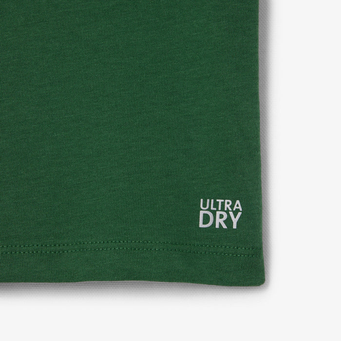 Green Ultra Dry t-shirt close-up showing hem and fabric texture.