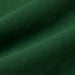 Green cotton fabric close-up showing texture and weave, ideal for baby and kids clothing.
