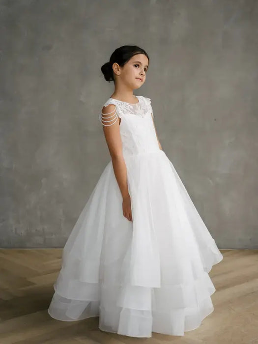 Teter Warm Lorelai Pearl communion dress shown on a young girl posing in a studio setting.