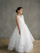 Teter Warm Lorelai Pearl communion dress shown on a young girl posing in a studio setting.