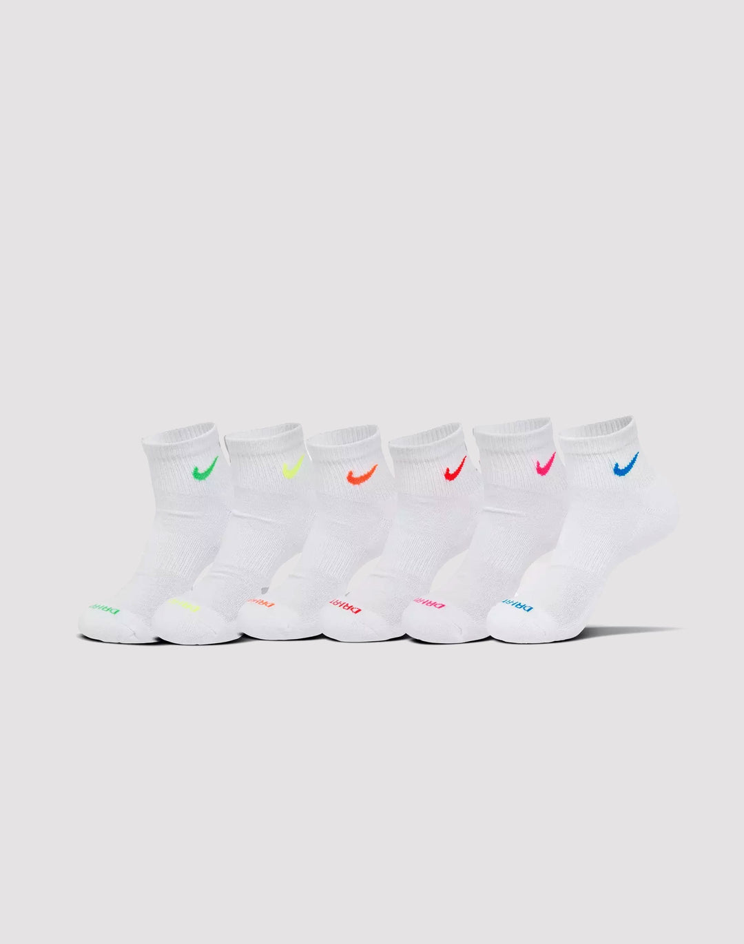 Children’s white ankle socks with colorful embroidered logos, shown lined up on a plain background.