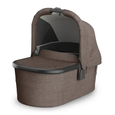 UPPAbaby bassinet in brown fabric with sun canopy, shown on a white background.