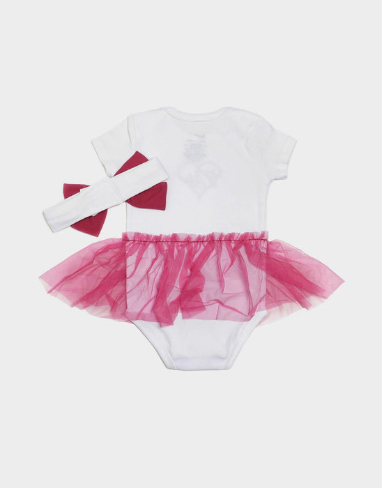 White baby onesie with pink tulle tutu skirt and matching headband laid flat on a white background.