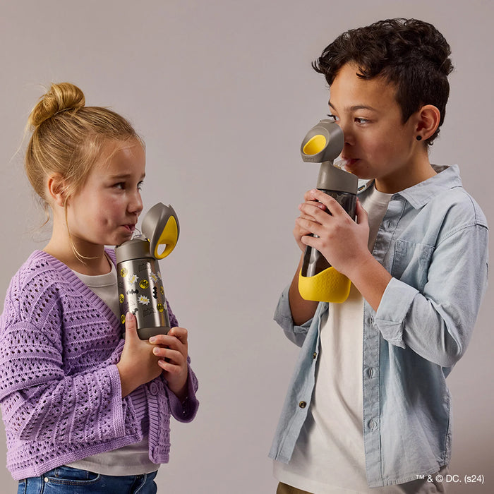 b.box insulated water bottle Batman design held by two kids, drinking together indoors