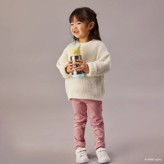 b.box insulated water bottle Looney Tunes edition held by smiling child in casual outfit