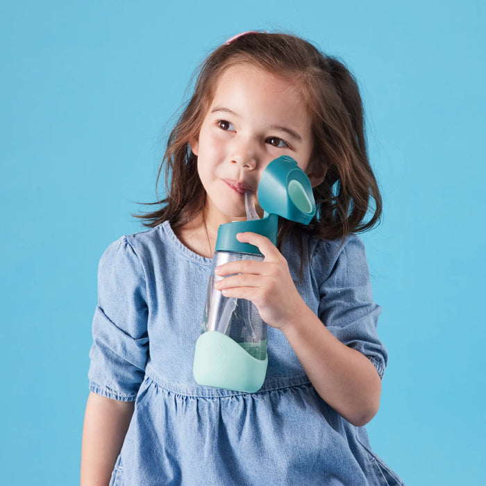b.box kids tritan drink bottle being used by a young girl against a blue background