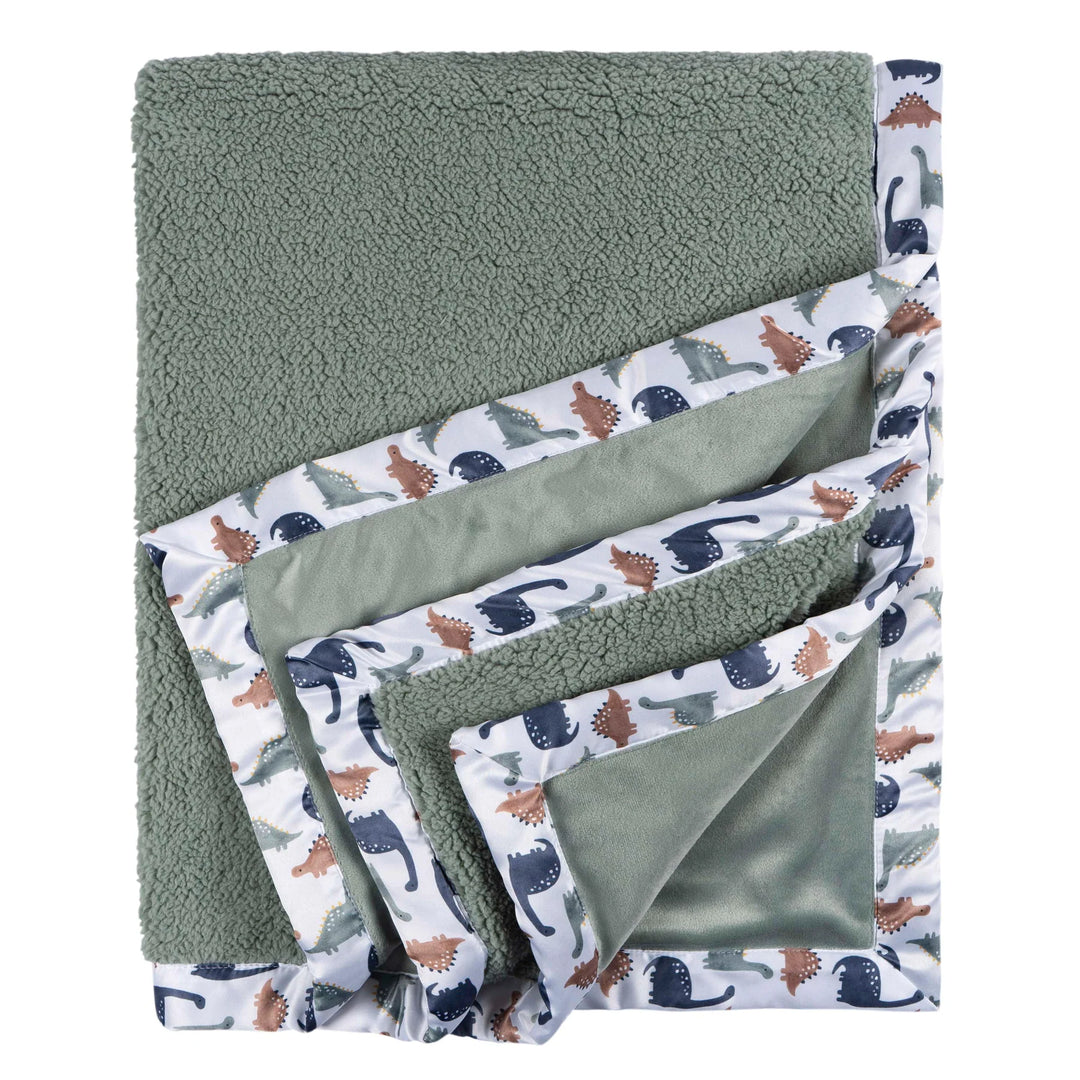 b.box microplush baby blanket dino time shown folded, with sage green plush and dinosaur print trim