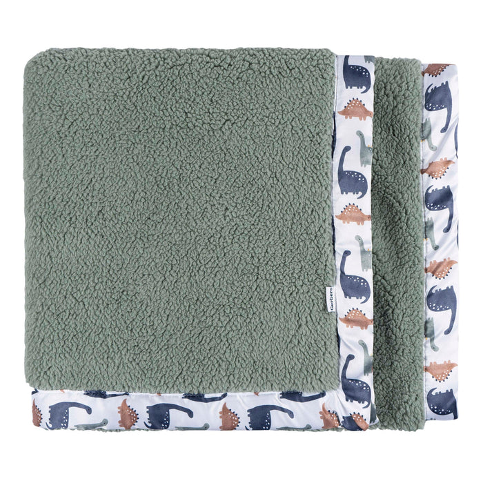 b.box microplush baby blanket with green fleece and dinosaur print trim, folded neatly