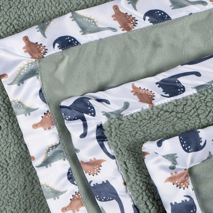 b.box microplush baby blanket with green fabric and dinosaur print trim, shown folded