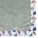 b.box microplush baby blanket with green center and dinosaur print border, shown flat.