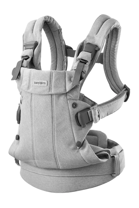 Light grey ergonomic baby carrier with adjustable padded straps and buckles