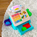 Baby Einstein® - Baby Einstein HAPE Magic Touch Cash Register Pretend to Check Out Toy