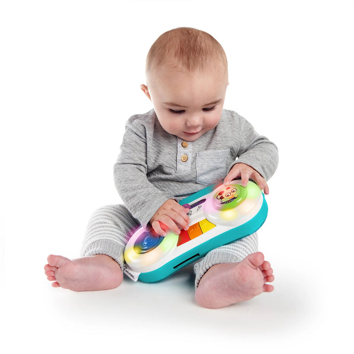 Baby Einstein Toddler Jams Musical Toy played by a baby sitting on a white background.