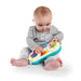 Baby Einstein Toddler Jams Musical Toy played by a baby sitting on a white background.