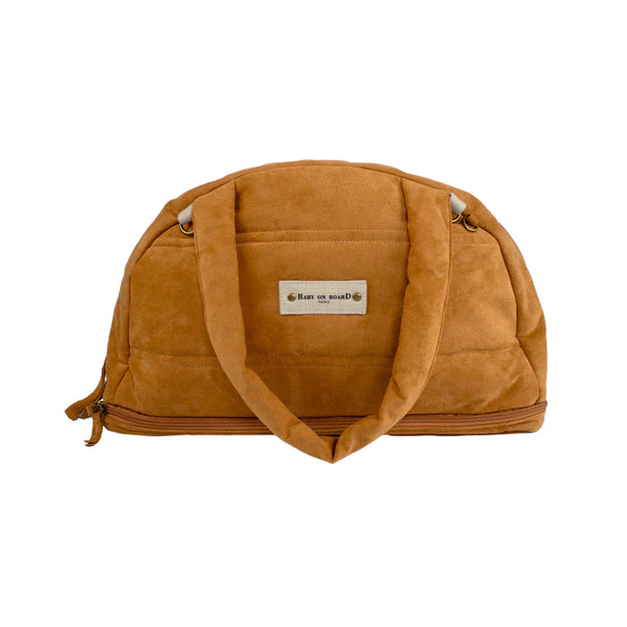 Baby On Board doudoune diaper bag in tan displayed upright on a white background.