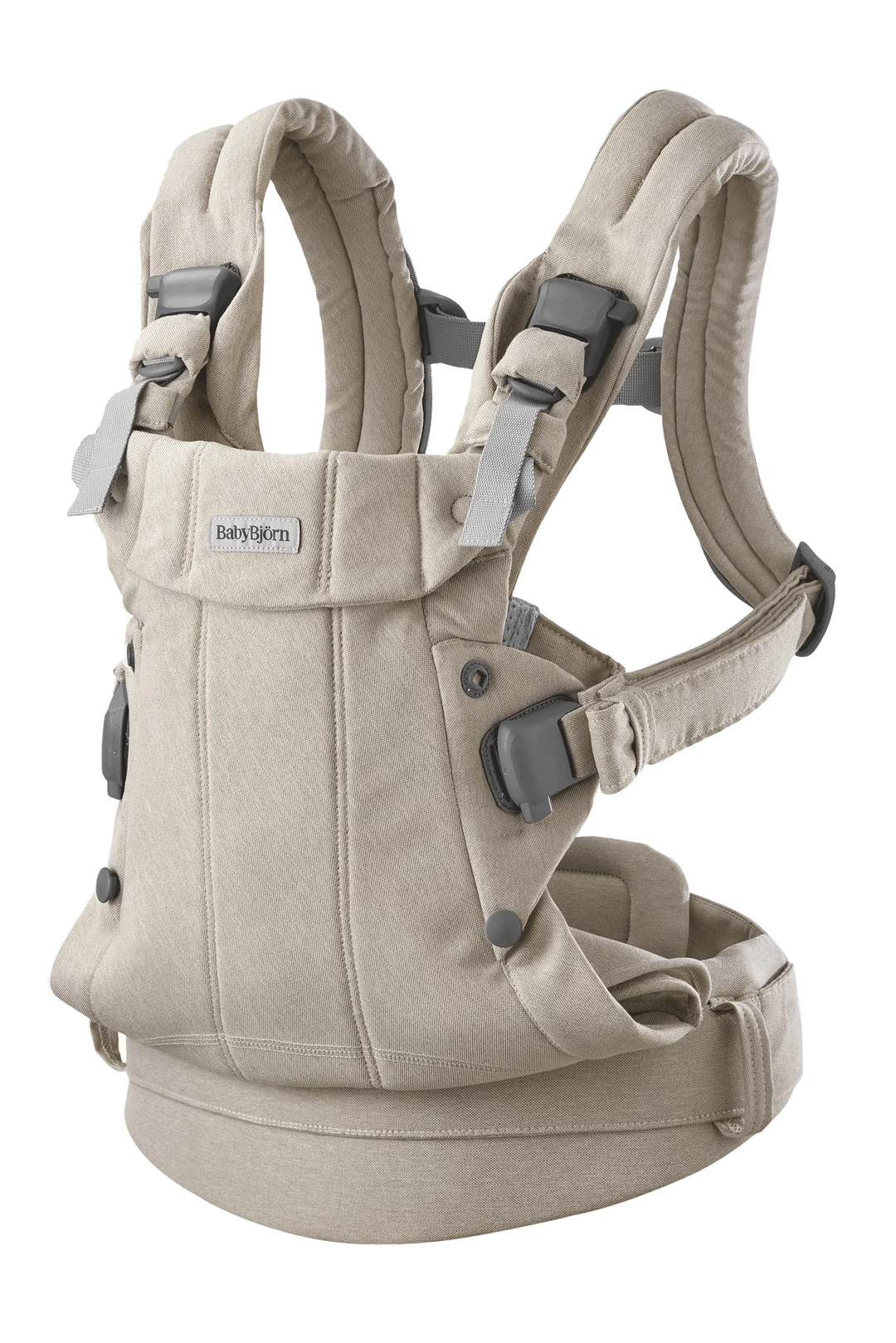BabyBjorn Baby Carrier Harmony in beige shown upright on a plain background.