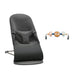 BabyBjörn charcoal baby bouncer with detachable toy bar shown on a white background.