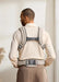 BabyBjorn Harmony Baby Carrier beige shown on man from behind indoors