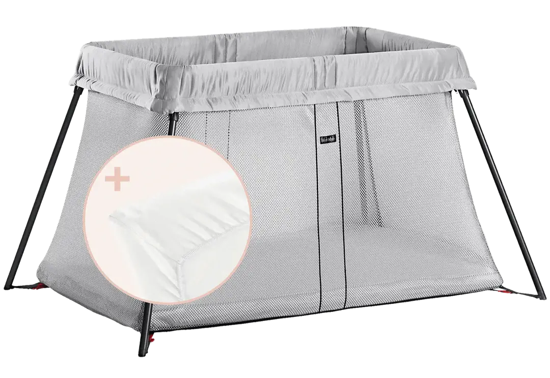 BabyBjorn Play Yard Light in silver color with mesh sides, shown with included mattress cover.