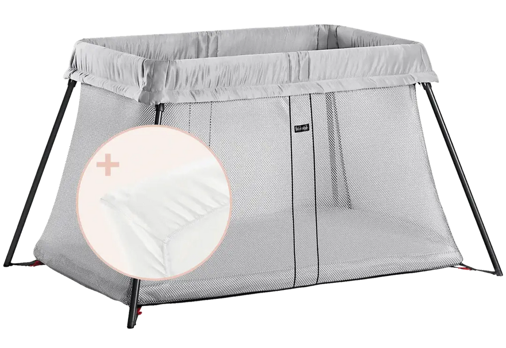BabyBjorn Play Yard Light in silver color with mesh sides, shown with included mattress cover.