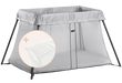 BabyBjorn Play Yard Light in silver color with mesh sides, shown with included mattress cover.