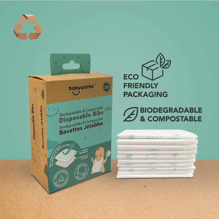 Babyworks biodegradable disposable bibs in eco-friendly packaging beside a neatly stacked pile of bibs.