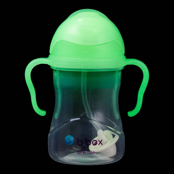b.box glow-in-the-dark baby sippy cup with handles shown against a black background.