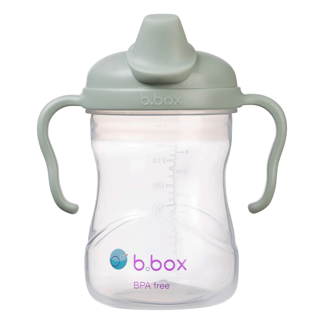 b.box silicone sippy cup in sage color shown upright with dual handles and measurement markings.