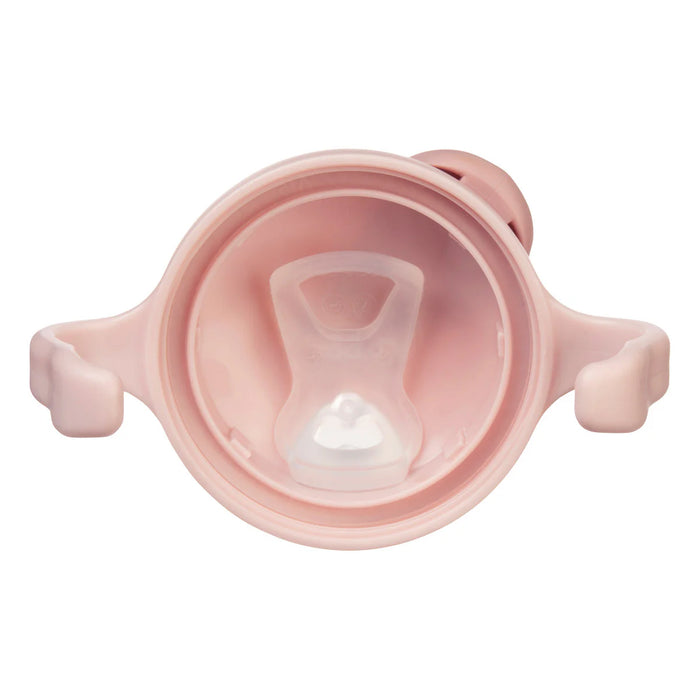 Bbox training silicone sippy cup in blush, shown from above highlighting soft spout and handles.