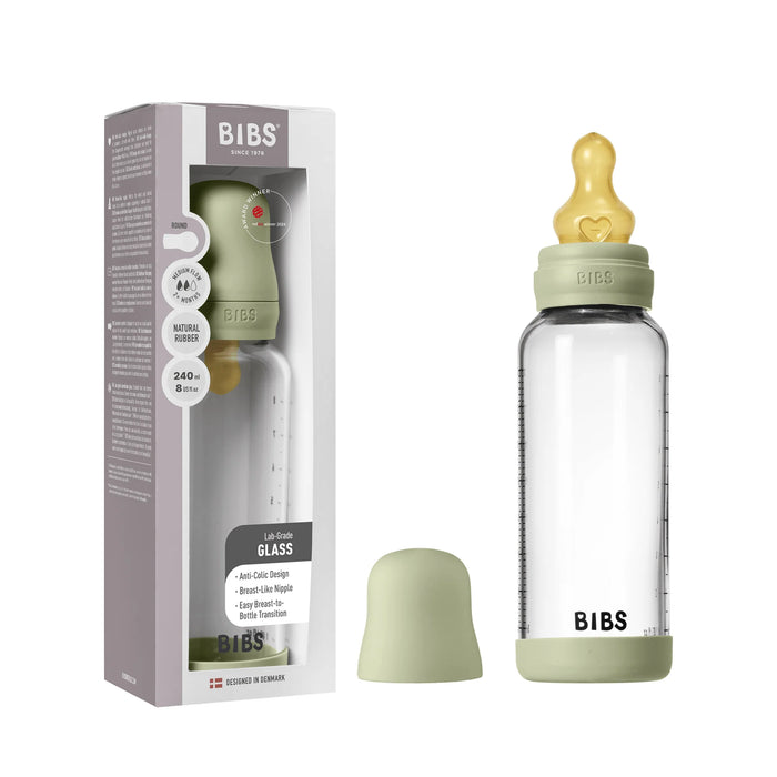 BIBS glass baby bottle with sage green cap shown next to packaging box and bottle cover.