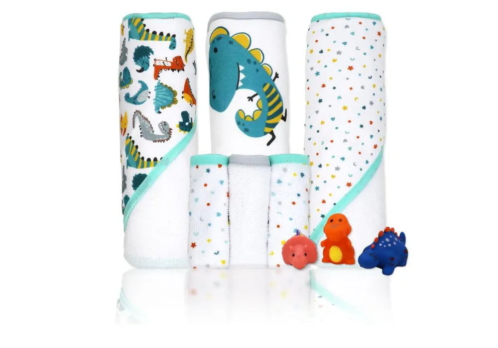 Baby hooded towels, washcloths with colorful dinosaur prints, and three dinosaur bath toys.