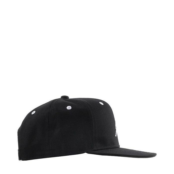 Black kids baseball cap with white eyelets, shown from the side on a plain white background.