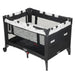 Cosco Funsport Playard in black with mesh sides and star print trim, shown on a white background.