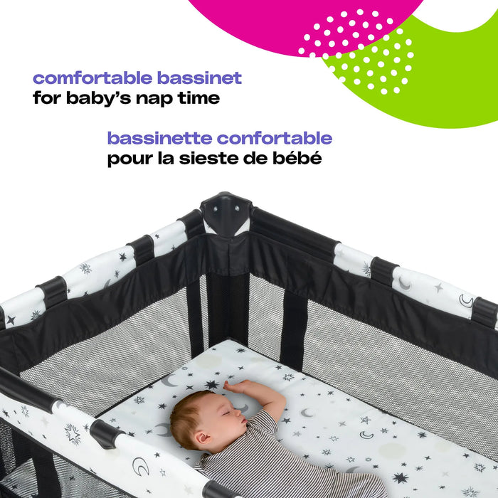 Cosco Funsport Playard with mesh sides, shown with a baby sleeping inside on a star-patterned mattress.