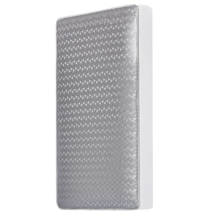 D.O.M 2-in-1 breathable slumber crib mattress shown standing upright with a gray dotted cover.