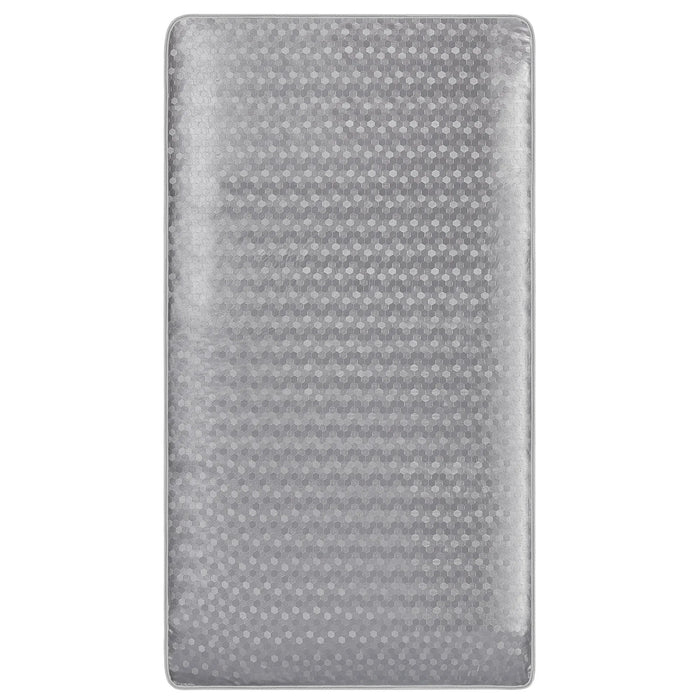 D.O.M. 2-in-1 breathable slumber crib mattress with hexagon patterned grey cover on white background.