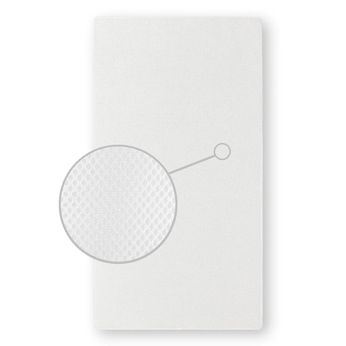 D.O.M. 2-in-1 Breathable Slumber crib mattress shown flat with close-up of breathable fabric texture.