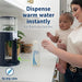 Dr. Brown’s Insta-Prep warm water dispenser on kitchen counter with parent preparing baby bottle.