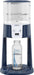 Dr. Brown’s Insta-Prep warm water dispenser on counter with a clear baby bottle underneath