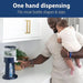 Dr. Brown's Insta-Prep warm water dispenser on a kitchen counter with a man holding a baby using it.