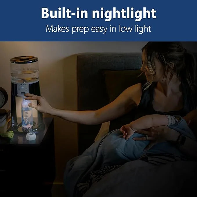 Dr. Brown’s Insta-Prep warm water dispenser with built-in nightlight on a bedside table, used at night.