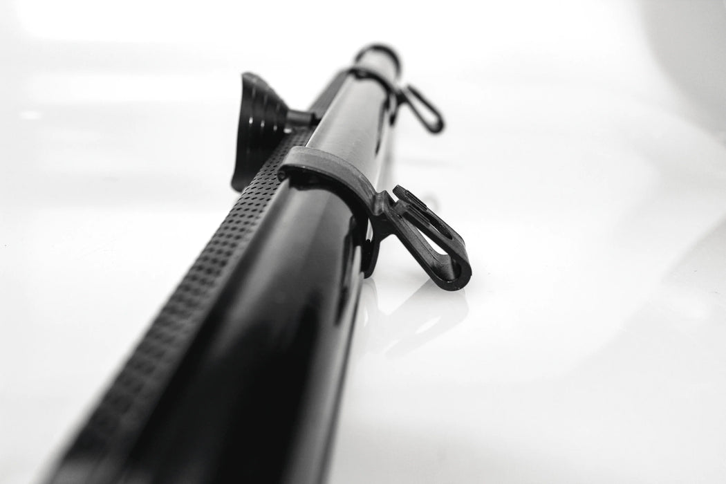Ezimoov Sun Roller car window shade shown close up with suction cup and attachment clips.