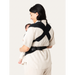 Flybaby 3D baby carrier shown on a woman carrying an infant, with black cross-strap design.