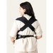 Flybaby 3D Baby Carrier shown on a person from the back, displaying cross-strap design.