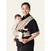 Flybaby 3D baby carrier in beige shown worn by an adult holding a baby against a neutral background.