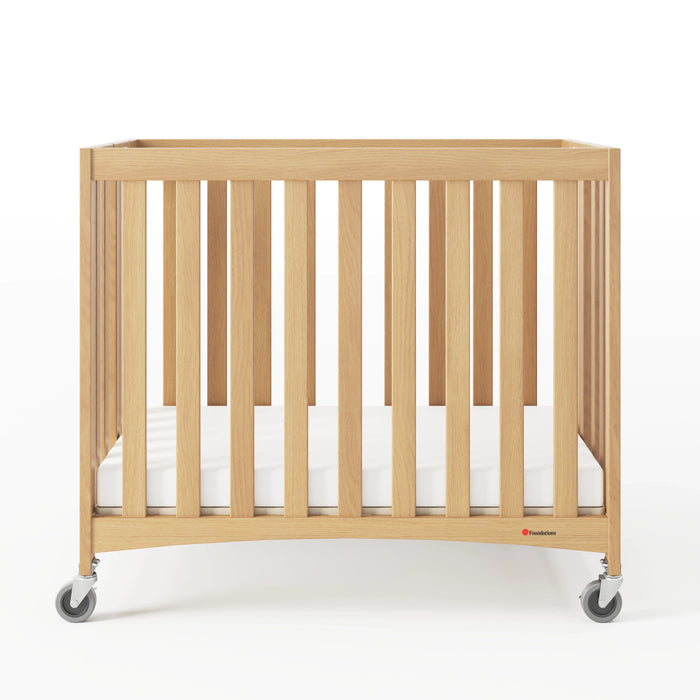 Foundations® - Foundations Travel Sleeper® Compact HideAway™ EasyRoll™ Solid Wood Folding Crib, Slatted with Oversized Casters (Including Foam Mattress)