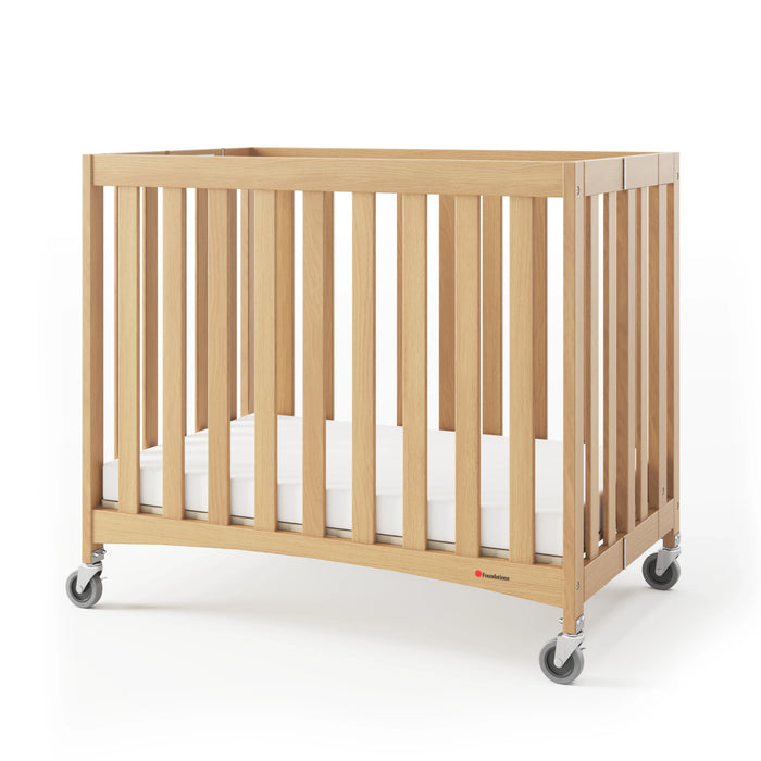 Foundations® - Foundations Travel Sleeper® Compact HideAway™ EasyRoll™ Solid Wood Folding Crib, Slatted with Oversized Casters (Including Foam Mattress)