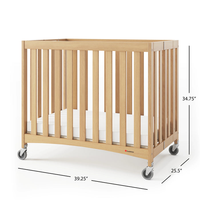 Foundations® - Foundations Travel Sleeper® Compact HideAway™ EasyRoll™ Solid Wood Folding Crib, Slatted with Oversized Casters (Including Foam Mattress)