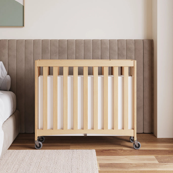 Foundations® - Foundations Travel Sleeper® Compact HideAway™ EasyRoll™ Solid Wood Folding Crib, Slatted with Oversized Casters (Including Foam Mattress)