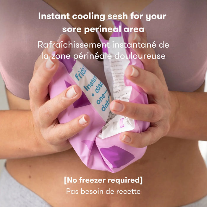 Frida Baby Instant Ice Maxi Pad being activated by a person in a close-up, home setting.